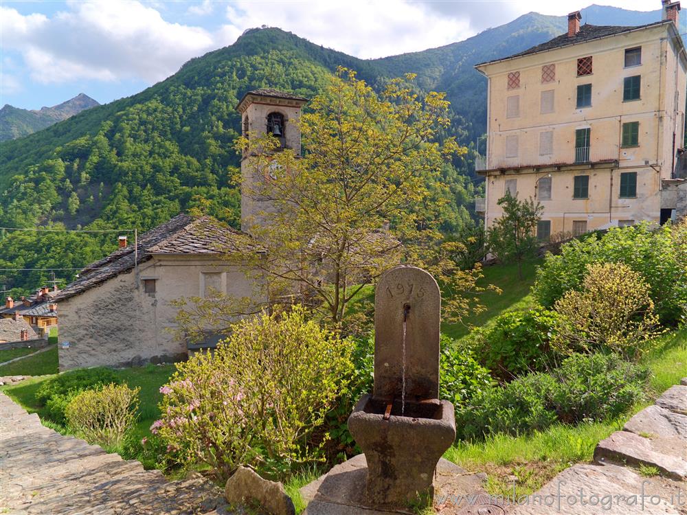 Montesinaro fraction of Piedicavallo (Biella, Italy) - A view with church and fountain